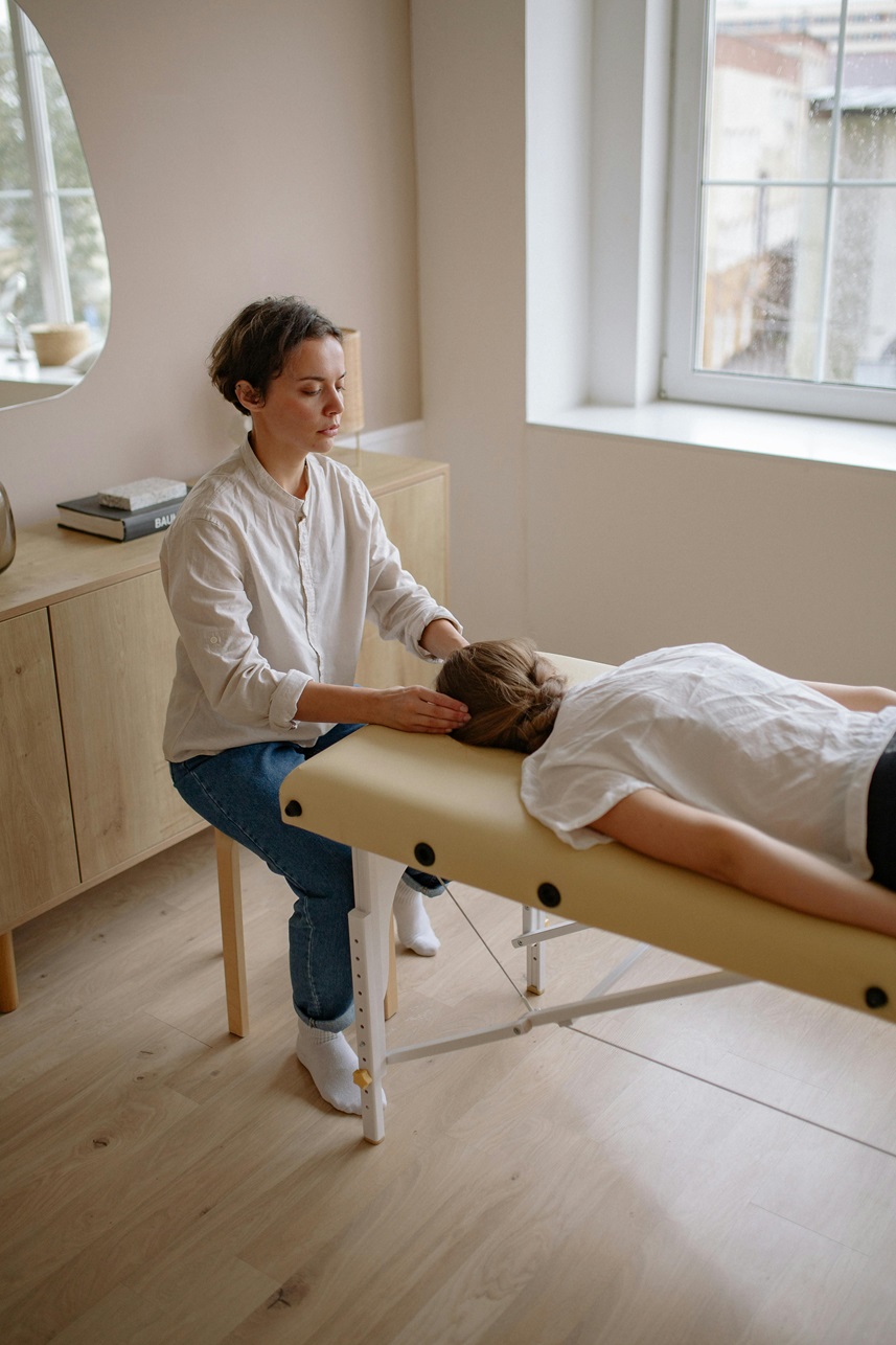 Female chiropractor with patient